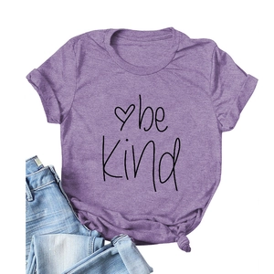 Purple crewneck t-shirt with 'be kind' print and heart design on white background