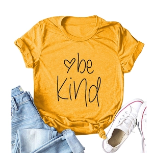 Ginger yellow Be Kind t-shirt with heart print and knot detail on casual blue denim