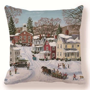Detail of square cushion cover featuring a hand-painted winter village snow scene