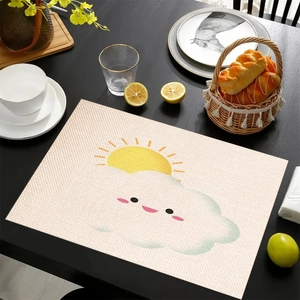 Mexican style linen placemat with sun and cloud pattern on dark wood dining table
