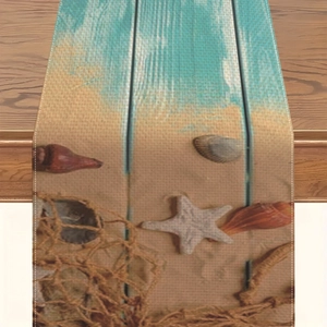 Chemin de table en lin thème océan avec étoiles de mer, coquillages et décor de plage