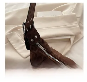 Detail of silver smooth zipper and leopard print fabric on a stylish baguette bag