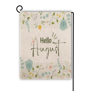 Detail view of the floral garden flag fabric with Hello August text on a black metal pole
