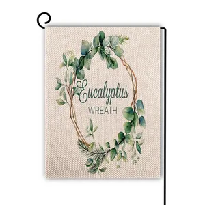 Detail of linen garden flag with watercolor eucalyptus wreath and fabric texture