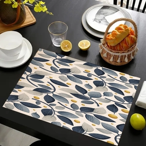 Close-up of linen placemat with eucalyptus leaf print and rustic texture for dining decor