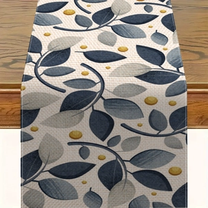 Runner da tavolo in lino con foglie di eucalipto blu e grigie su tessuto beige intrecciato