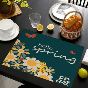 Linnen placemat met hello spring bloemenpatroon en madeliefjes op een houten tafel