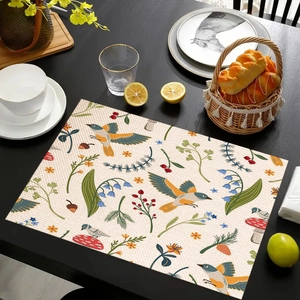 Detailed view of linen placemat featuring retro bird, floral, and mushroom prints