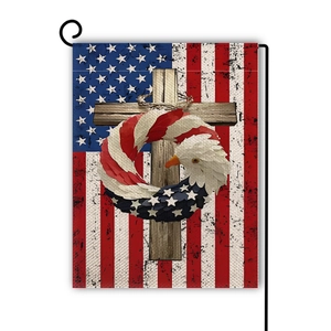 Detail of linen Independence Day garden flag with patriotic eagle and cross on metal pole