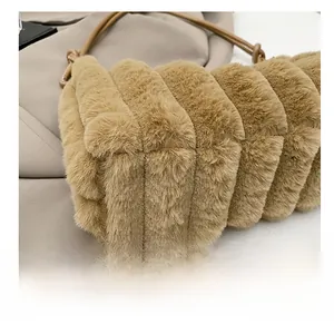 Detailed view of the durable base and soft plush texture on the camel shoulder bag