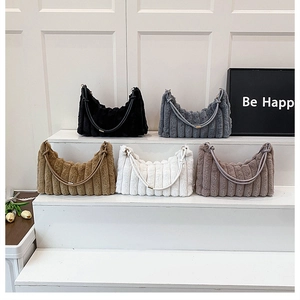 Detailed display of plush shoulder bags in five colors with soft vertical stripe texture