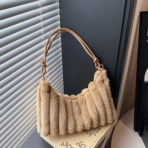 Stylish plush pleated hobo bag in beige with knotted straps and a faux fur texture