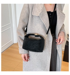 Classic black suede texture crossbody bag with gold metal buckle and thin shoulder strap