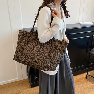 Minimalist large leopard print tote bag for women showing a stylish oversized daily shoulder bag