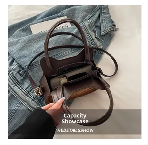 Capacity display showing spacious interior of the cat-shaped mini saddle bag with a camera