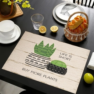 Detailed texture of rectangular linen placemat with green plants and artistic typography