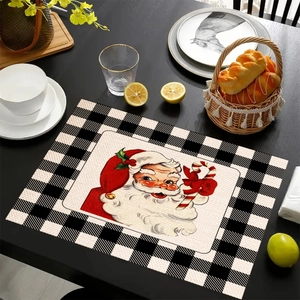 Dettaglio della trama del set di tovagliette in lino con Babbo Natale e bordo a quadri