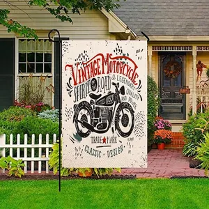 Vintage motorcycle garden flag made of burlap displayed on a black metal stake in a yard