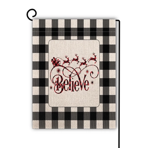 Close-up of double-sided Christmas garden flag with reindeer sleigh and Believe print