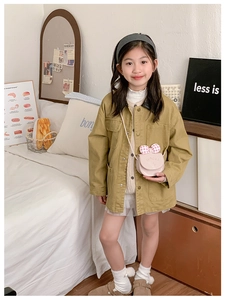 Pink checkered kitten crossbody bag with bow detail on a stylish child outfit