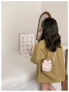 Pink semi-circle crossbody bag for kids with checkered bow and embroidered details