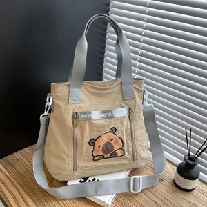 Cute khaki canvas tote bag with cartoon bear patch and adjustable shoulder strap