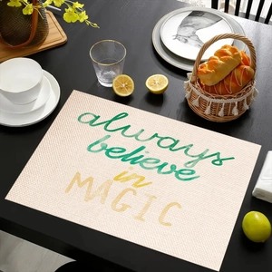 Close-up of linen placemat with Always Believe in Magic text and lemon kitchen decor
