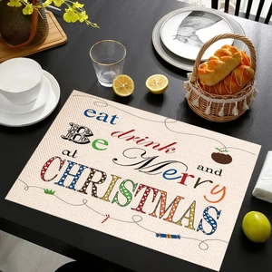 Detail van kerst placemat van linnen met feestelijke belettering op houten tafel