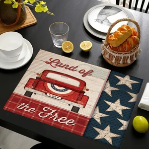 Dettaglio di tovaglietta in lino con camion rosso vintage e motivi della bandiera USA