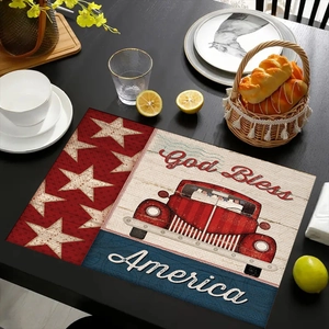 Dettaglio della tovaglietta in lino con camion rosso vintage e stampa God Bless America