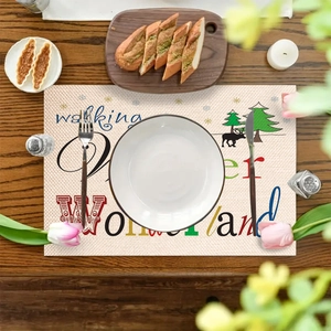 Linnen kerst placemat met Winter Wonderland hert print op een houten tafel