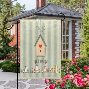 Garden flag detail showing birdhouse and birds with Life is Beautiful text on linen