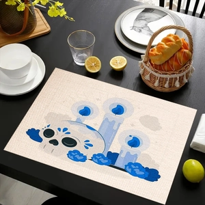 Linen placemat with Day of the Dead skull print on a dining table with bread basket