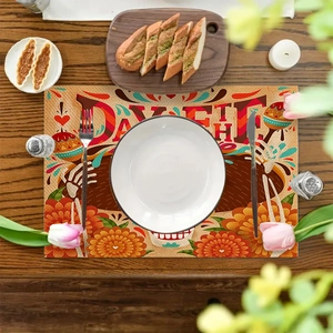 Day of the Dead linen placemat with skull pattern on dark wooden dining table