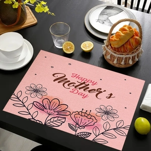Macro detail of linen texture placemat with Happy Mother's Day floral print and watercolor