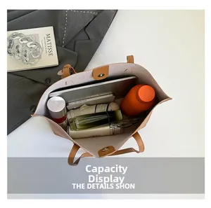 Large capacity tote bag interior showing space for tablet, umbrella and makeup
