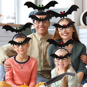 Family wearing Halloween black bat wing headbands and glasses for festive party decorations