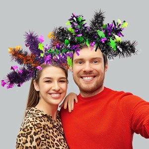 Detail of Halloween headbands with colorful tinsel, purple bats and green ghost icons