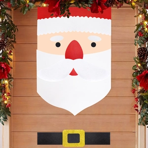Detail of Santa Claus non-woven door decoration with belt and festive Christmas wreath