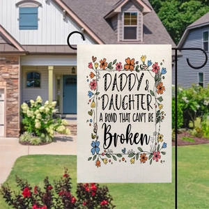 Detail of double-sided linen garden flag with Daddy and Daughter quote on black metal stand