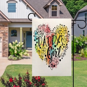 Detailed view of linen garden flag with Daddy's Girl text and heart design in yard