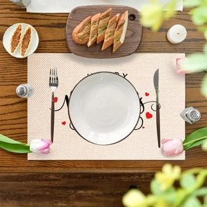 Linen placemat with Happy Valentine's Day heart print on rustic wooden table
