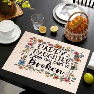 Detail of linen placemat featuring Daddy and Daughter quote with floral border decor