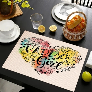 Detail of linen placemat featuring watercolor heart and Daddy's Girl text on wood table