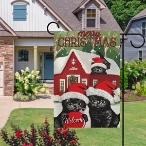 Outdoor Christmas garden flag with three black cats in santa hats near a red barn