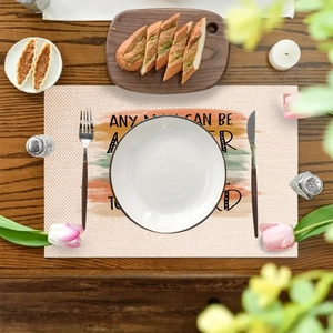 Linen placemat with Father's Day rainbow print and quote on dark wood dining table