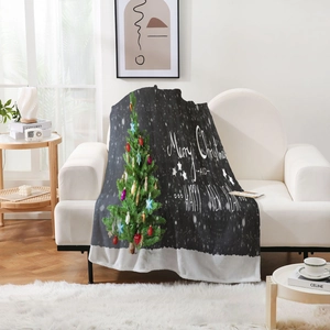 Detail of Christmas tree print on flannel blanket with soft white sherpa fleece lining