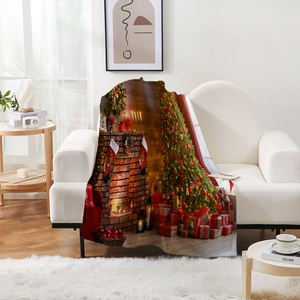 Detailed Christmas flannel blanket with trees and fireplace print on a white sofa