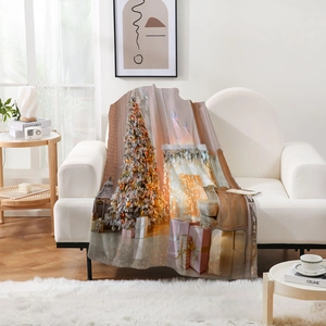 Thick flannel Christmas blanket with warm fireplace and tree print on white sofa