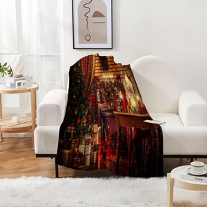 Close-up of thick flannel blanket with Christmas tree and Santa Claus digital print on sofa
